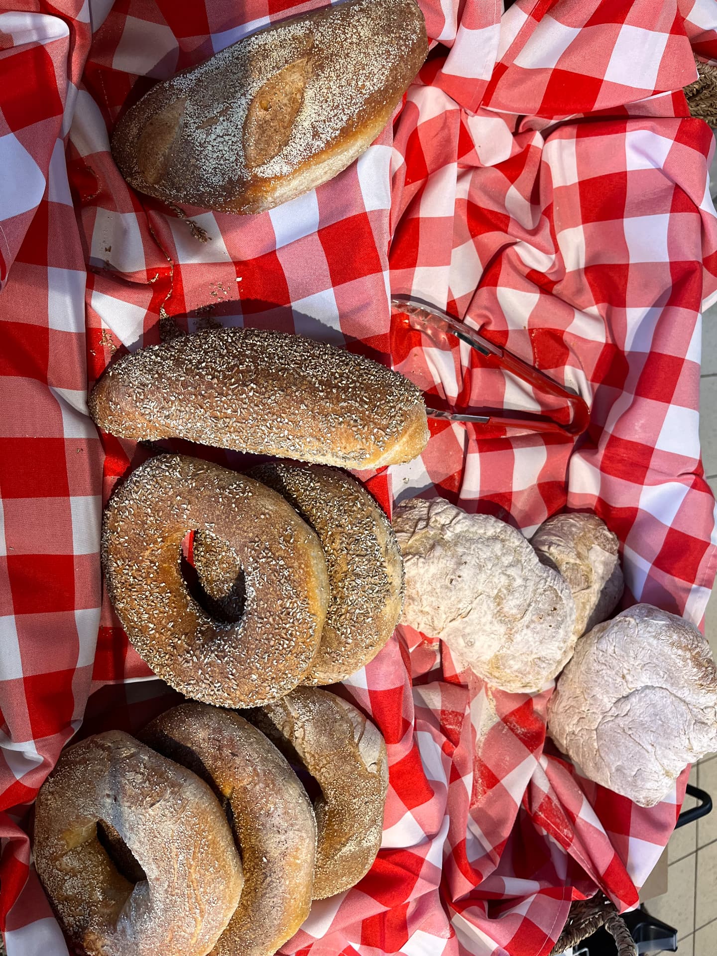 Sesame bread rings and rustic loaves